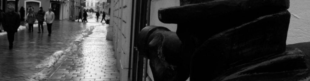 Black-and-white street scene with pedestrians, evoking background checks and surveillance by Tristar private investigator California