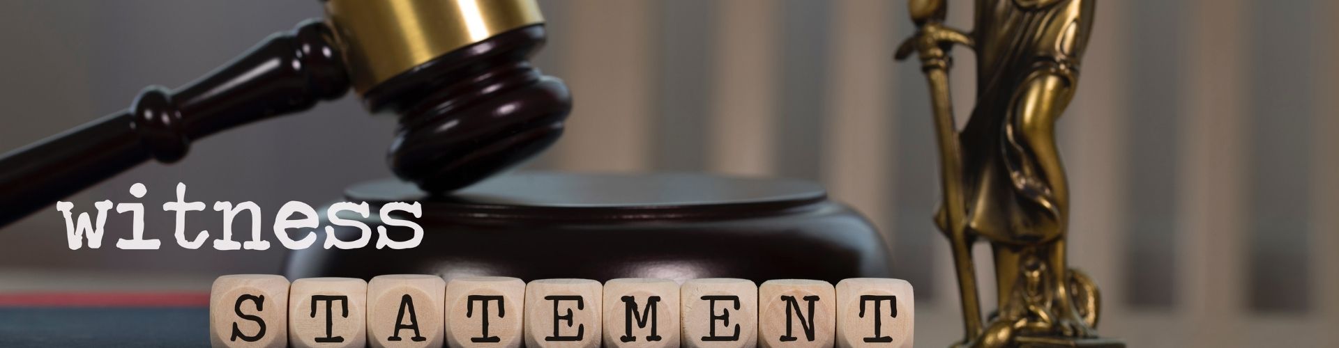 Gavel and wooden blocks spelling STATEMENT with 'witness' text, illustrating witness statements
