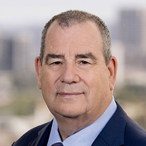 Professional headshot of an experienced male attorney in suit for bankruptcy and foreclosure fraud cases