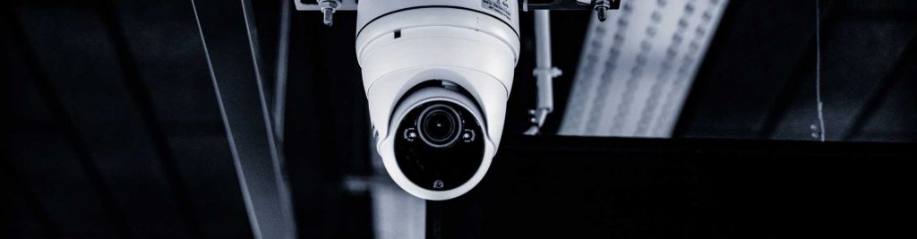 Licensed corporate surveillance investigators conducting discreet business investigations in a California office