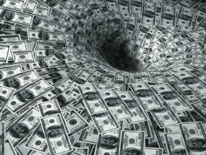 Whirlpool of US $100 bills spiraling into a dark hole, symbolizing investment fraud losses