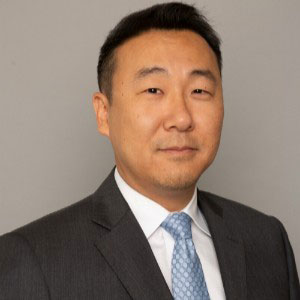 Professional headshot of a male attorney in suit and tie, offering bankruptcy and foreclosure fraud investigation support