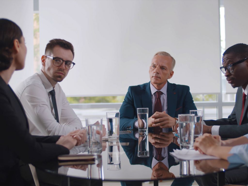 Business executives meeting to discuss corporate leadership and organizational decision-making