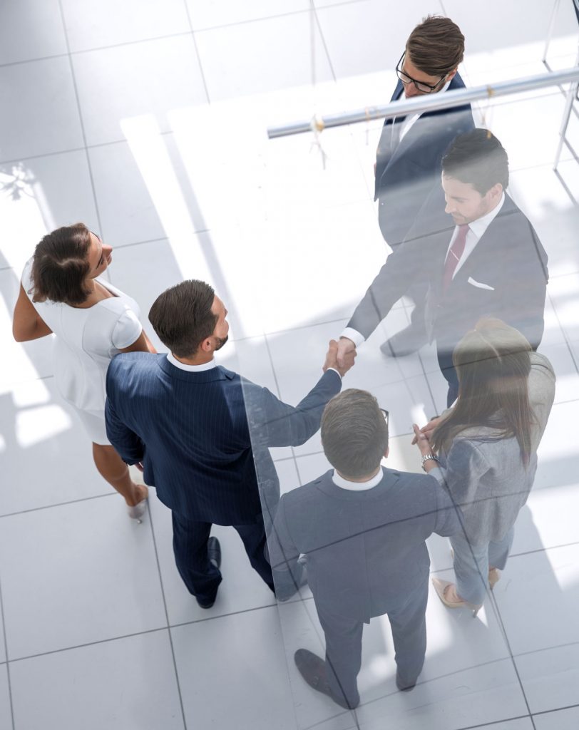 Business professionals meeting to strengthen litigation strategy through business relationship investigations