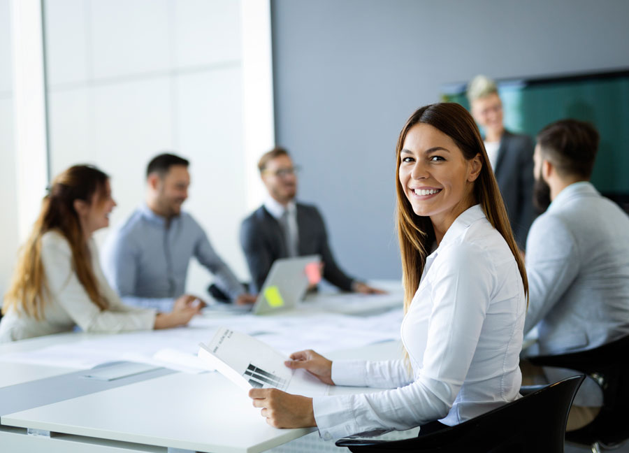 Legal team meeting around a conference table to plan next steps in a case